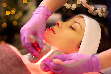 Image showing young woman having face microdermabrasion at spa