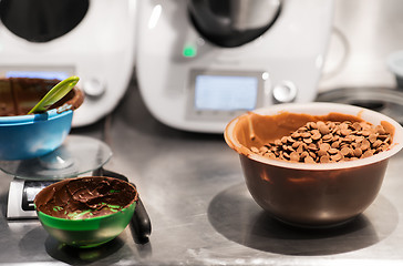 Image showing chocolate buttons in bowl at confectionery shop