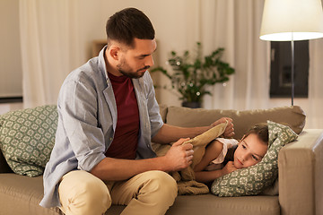 Image showing father taking care of ill daughter at home