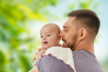 Image showing father with little baby over natural background