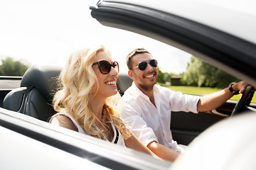 Image showing happy man and woman driving in cabriolet car