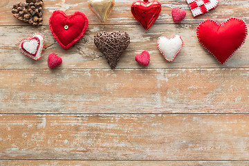 Image showing heart shaped decorations on wooden background