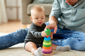 Image showing father playing with little baby daughter at home