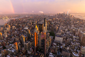 Image showing New York City skyline with Manhattan skyscrapers at dramatic stormy sunset, USA.