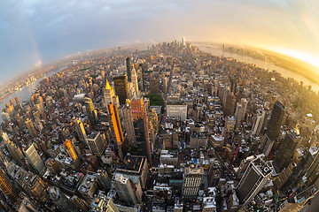 Image showing New York City skyline with Manhattan skyscrapers at dramatic stormy sunset, USA