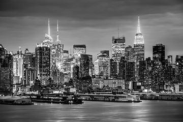 Image showing West New York City midtown Manhattan skyline view from Boulevard East Old Glory Park over Hudson River at dusk.