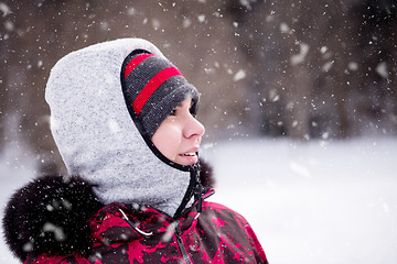 Image showing Portrait of young woman on snowy winter day