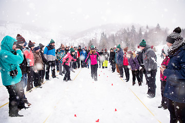 Image showing group of young people having blindfolded games competition