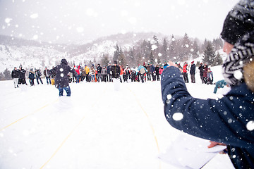 Image showing group of young people having a running in bag competition