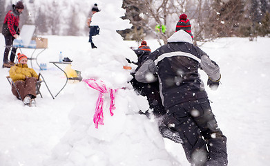 Image showing group of young people having fun in beautiful winter landscape