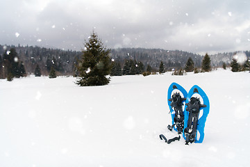 Image showing Blue snowshoes in fresh show