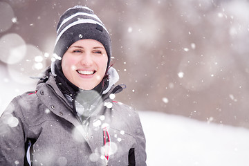 Image showing Portrait of young woman on snowy winter day