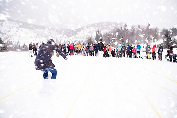 Image showing group of young people having a running in bag competition