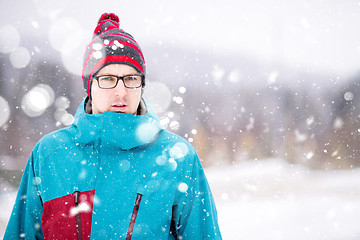 Image showing Portrait of young man on snowy winter day