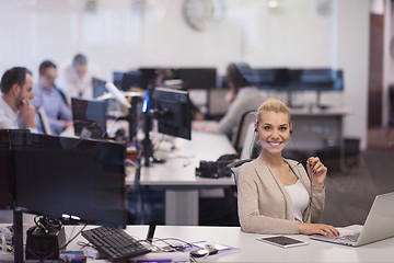 Image showing businesswoman using a laptop in startup office