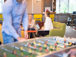 Image showing Office People Enjoying Table Soccer Game