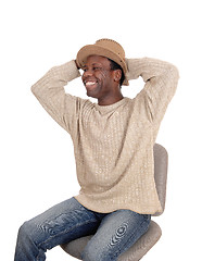 Image showing Happy young African man sitting with hat