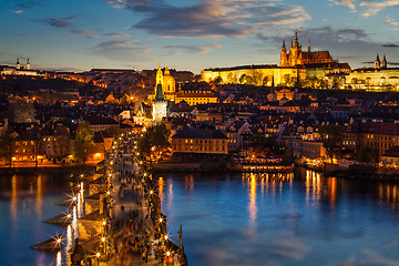 Image showing Night view of Prague castle and Charles Bridge over Vltava river