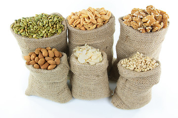 Image showing Nuts and seeds in burlap bags. 