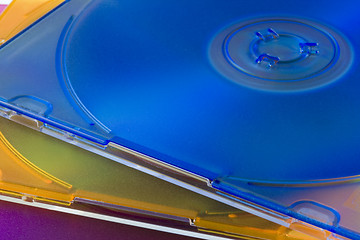 Image showing CD or DVD disks in colorful jewel cases