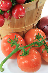 Image showing Wooden Bushel and Tomatoes on the vine. 