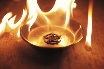 Image showing Old pentagram burning in flames