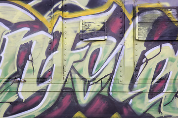 Image showing colorful graffiti on a train