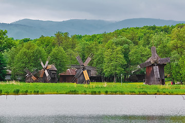 Image showing Windmills on the Bank of Lake