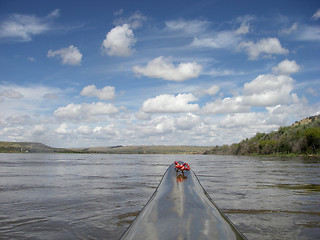 Image showing paddling racing kayak on river with desert landscape