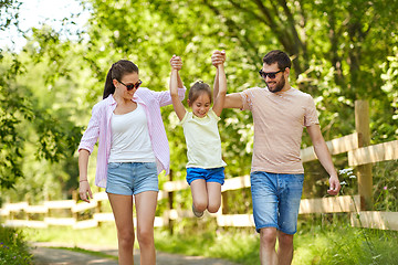 Image showing happy family walking in summer park