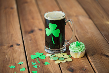 Image showing shamrock on glass of beer, green cupcake and coins