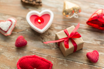 Image showing christmas gift, heart shaped decorations, candle