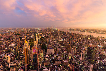 Image showing New York City skyline with Manhattan skyscrapers at dramatic stormy sunset, USA.