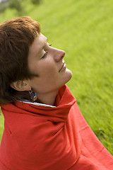 Image showing woman sitting on the grass