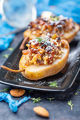 Image showing Delicious baked pears with nuts and raisins.