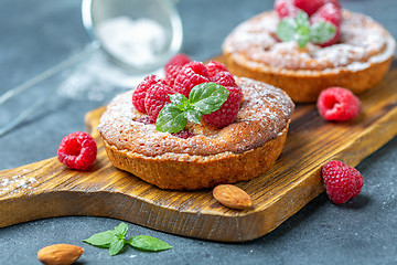 Image showing Delicious mini-tarts (tartlets) with raspberries.