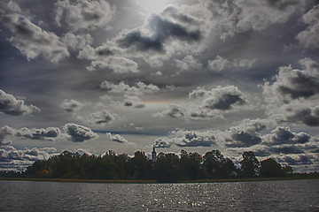 Image showing Church on island with clouds and sun