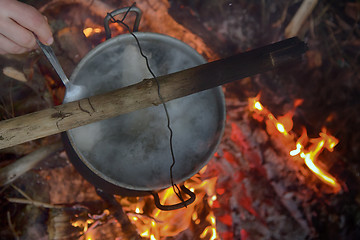 Image showing picnic in winter on nature of a bonfire