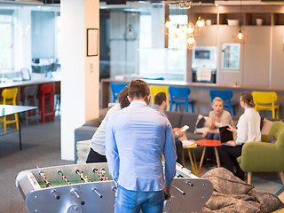 Image showing Office People Enjoying Table Soccer Game