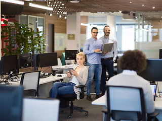 Image showing businessman working using a laptop in startup office