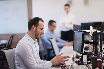 Image showing businessman working using a laptop in startup office