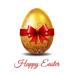 Image showing Gold Easter egg tied of red ribbon