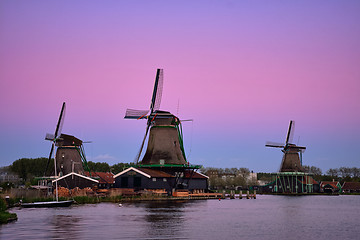 Image showing Windmills at Zaanse Schans in Holland in twilight after sunset. 