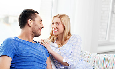 Image showing happy couple with laptop computer at home