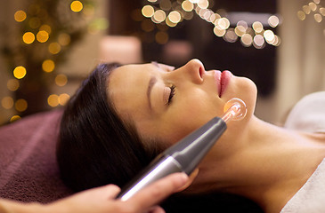 Image showing woman having hydradermie facial treatment in spa