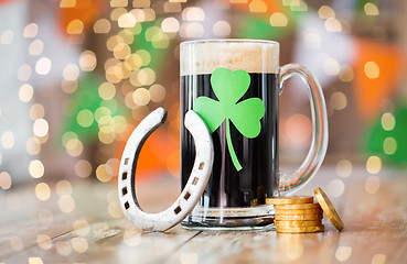 Image showing shamrock on glass of beer, horseshoe and coins