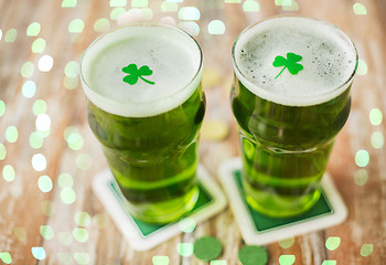 Image showing glasses of green beer with shamrock and gold coins