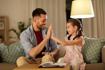 Image showing father and daughter doing homework together