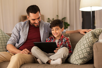 Image showing father and son with tablet pc playing at home