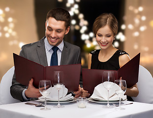 Image showing couple with menus at restaurant